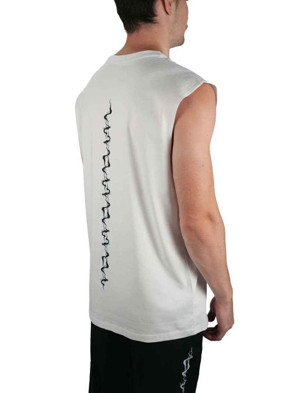 Model wearing the white "GODMODE V2" tank (back view), embodying the mindset with the lightning graphic from the RHSM calisthenics clothing brand.