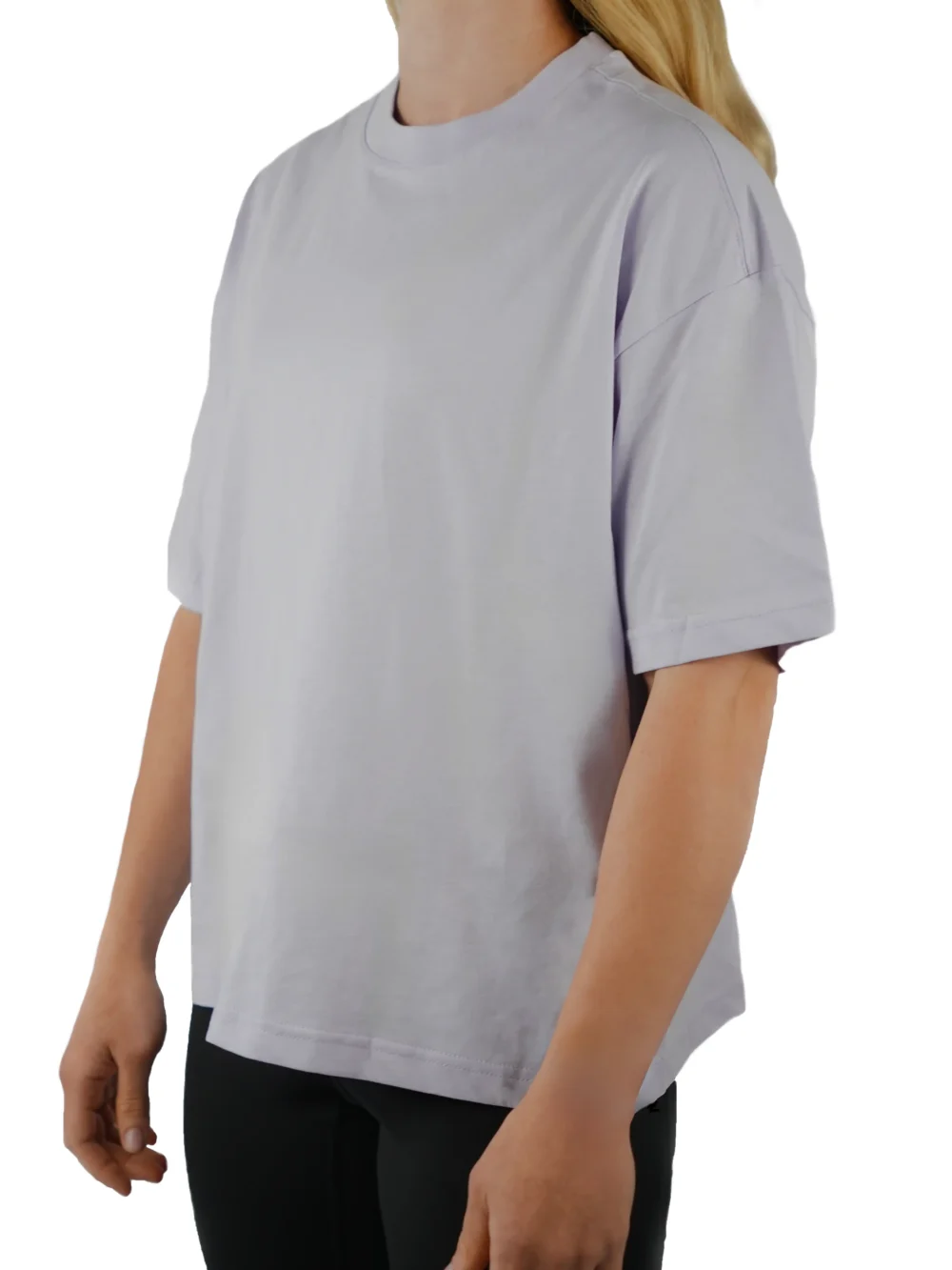 A female model wearing the lilac oversized boxy tee from the front, demonstrating its modern boxy silhouette and dropped shoulder fit.