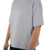 A female model wearing the lilac oversized boxy tee from the front, demonstrating its modern boxy silhouette and dropped shoulder fit.