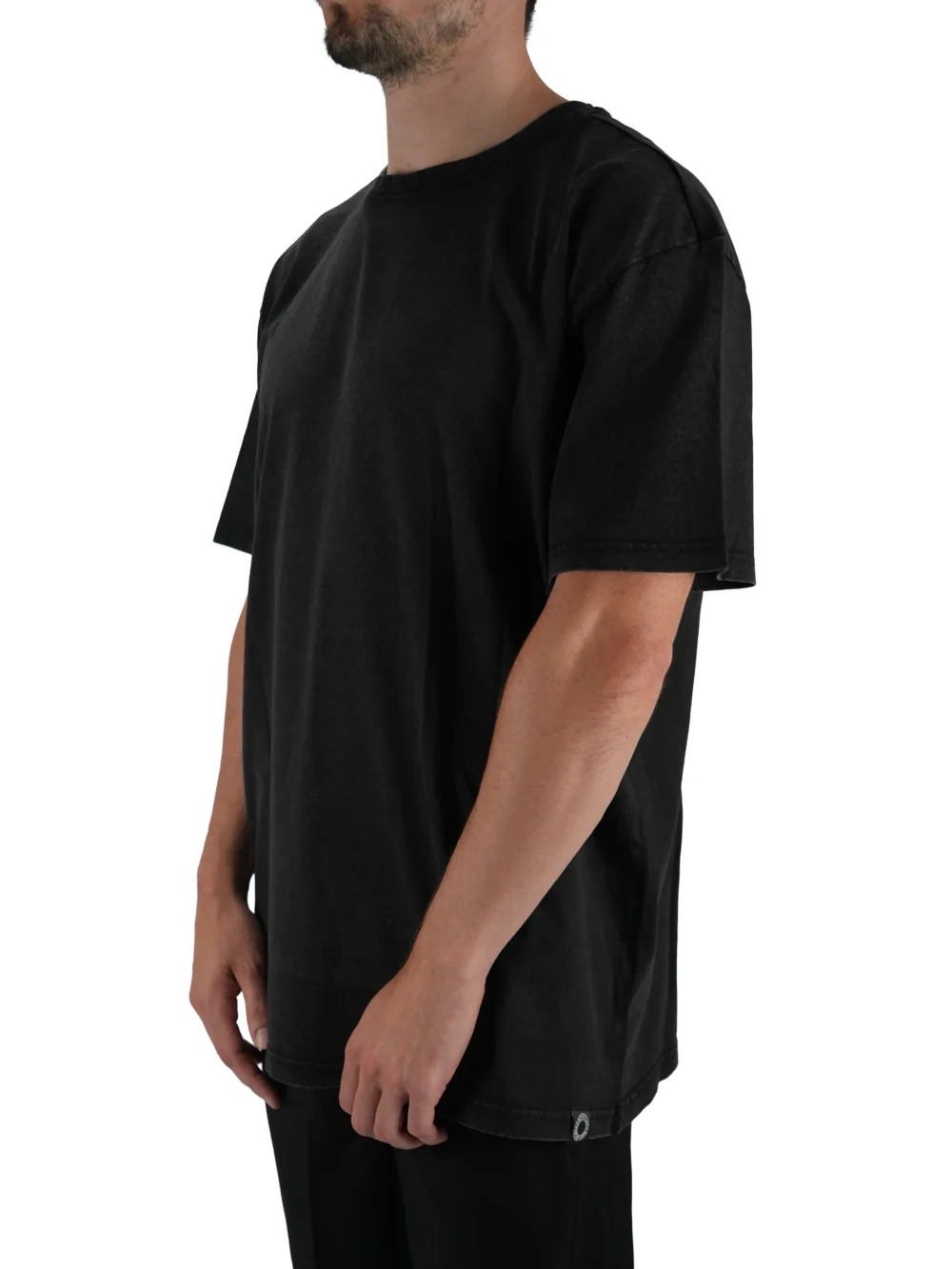 Model wearing the charcoal oversized acid wash tee (front view), showing the modern oversized fit of this essential workout gear.