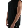 Model wearing the black oversized tank (front view), demonstrating the loose fit and dropped shoulders of this workout gear.