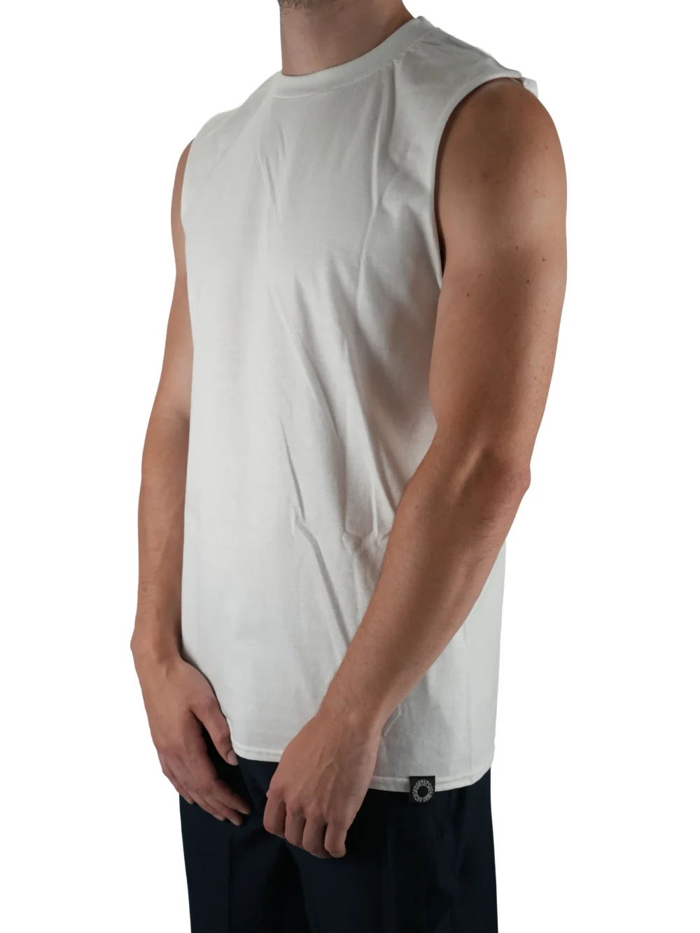 Model wearing the white oversized tank (front view), showing the modern loose fit of this premium workout gear.
