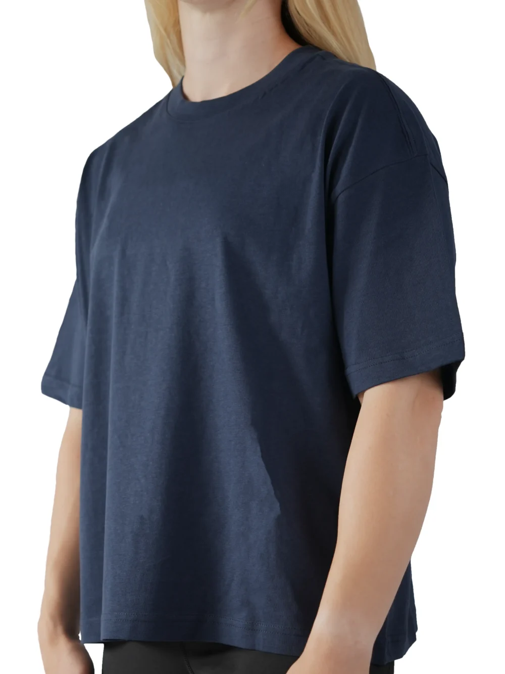 A female model wearing the navy oversized boxy tee from the front, demonstrating its modern boxy silhouette and dropped shoulder fit.
