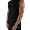 Model wearing the black oversized "[RHXSM]" tank (front view), demonstrating the loose fit and dropped shoulders of this workout gear.