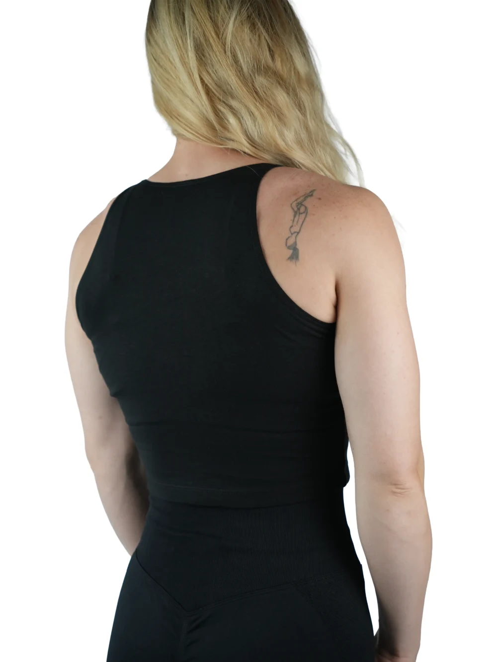 Model wearing the black "[RHXSM]" crop top (back view), showcasing the racerback design from the calisthenics clothing brand RHSM.
