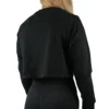 Model wearing the black "[RHXSM]" cropped crew (back view), showcasing the relaxed silhouette from the calisthenics clothing brand RHSM.