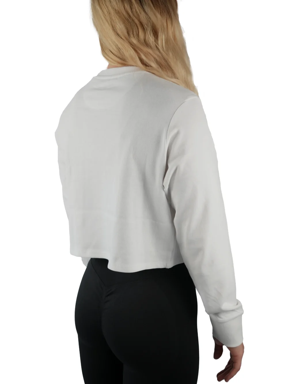 Model wearing the white "[RHXSM]" cropped crew (back view), demonstrating the versatile fit and stylish cropped silhouette.