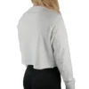 Model wearing the white "[RHXSM]" cropped crew (back view), demonstrating the versatile fit and stylish cropped silhouette.