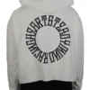Model wearing the back of the white cropped hoodie, detailing the statement "Racing Heart Steady Mind" graphic from the RHSM calisthenics clothing brand.