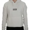 Model wearing the white RHSM 1st Edition cropped hoodie, demonstrating the modern athletic cut of the women's fitness apparel.