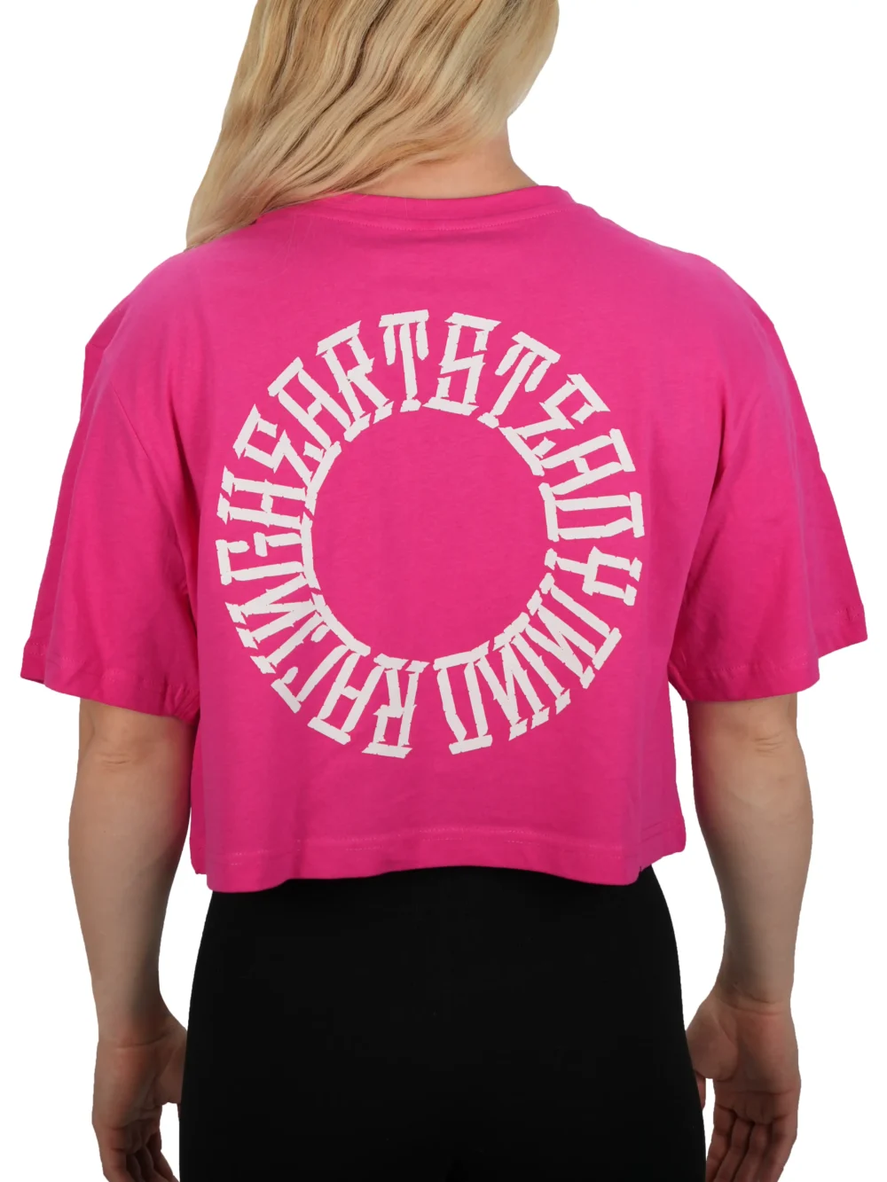 Model showing the back of the pink oversized tee, representing the philosophy of the RHSM calisthenics clothing brand.