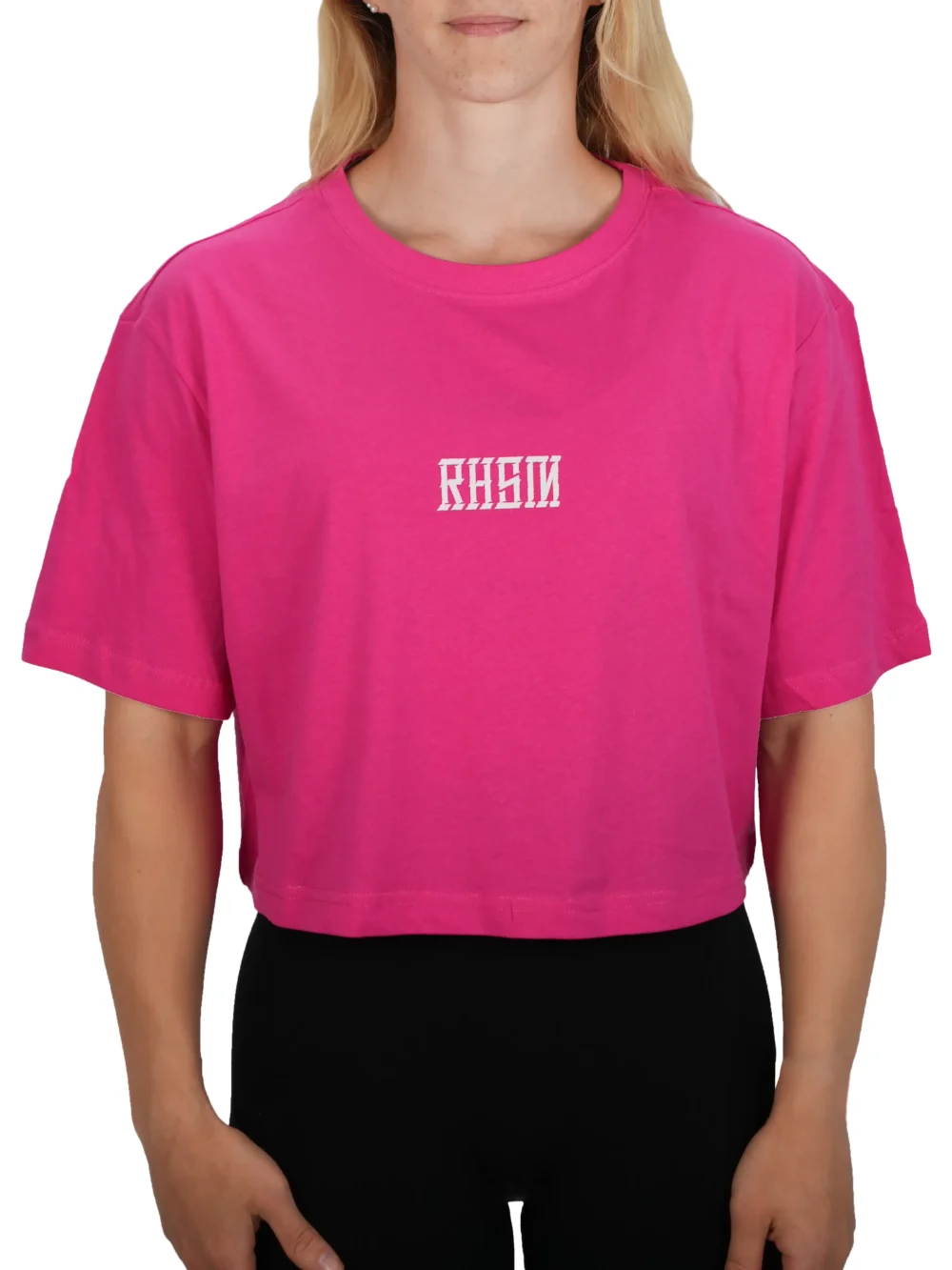 Model wearing the pink RHSM 1st Edition oversized tee, showing the modern oversized drape of the fitness apparel.