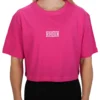 Model wearing the pink RHSM 1st Edition oversized tee, showing the modern oversized drape of the fitness apparel.