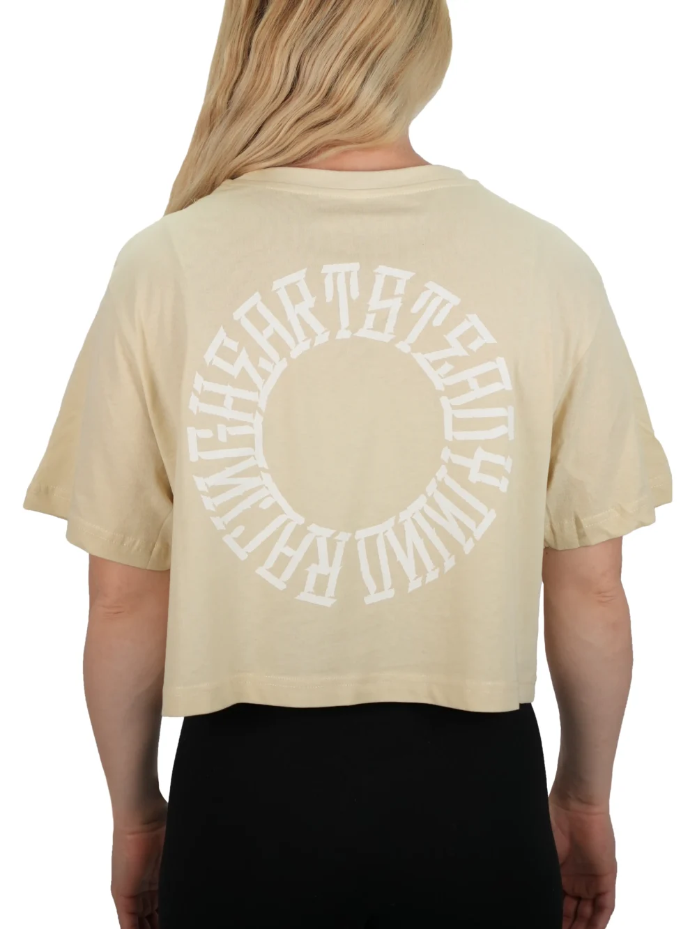 Model showing the back print on the sand oversized tee, the signature graphic of the RHSM calisthenics clothing brand.