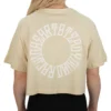 Model showing the back print on the sand oversized tee, the signature graphic of the RHSM calisthenics clothing brand.