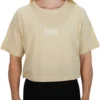 Model wearing the sand RHSM 1st Edition oversized tee, showing the comfortable fit for workout or lifestyle wear.