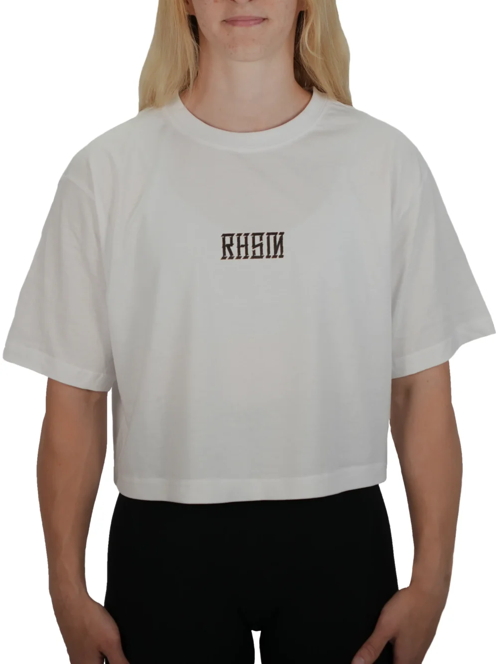 Model wearing the white RHSM 1st Edition oversized tee, demonstrating the modern cut of the women's fitness apparel.