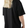 Model showing the drape of the black graphic tee, representing the streetwear style of the RHSM calisthenics clothing brand.
