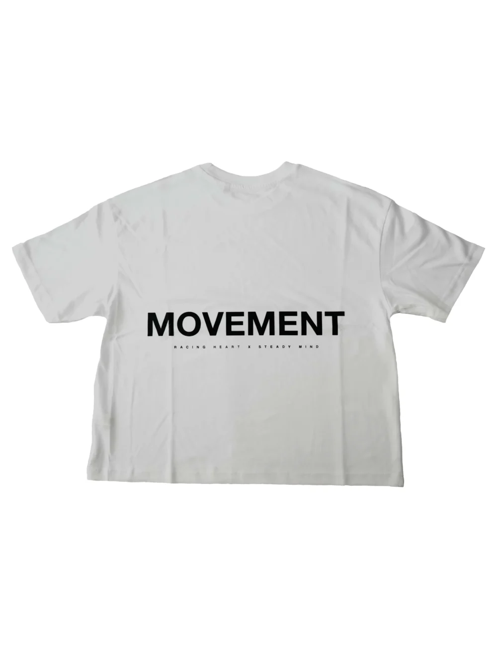 Flat lay of the white RHSM MVMT Oversized Boxy Tee, showing the back with the minimalist black "Movement" graphic.