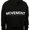 Model wearing the black RHSM MVMT cropped hoodie (back view), highlighting the signature white motivational "Movement" graphic and hood.