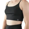 Model wearing the black RHSM Minimalist Sports Bra, demonstrating the secure, slim fit of the fitness apparel.