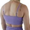 Model showing the back strap design of the lavender sports bra, from the RHSM calisthenics clothing brand.