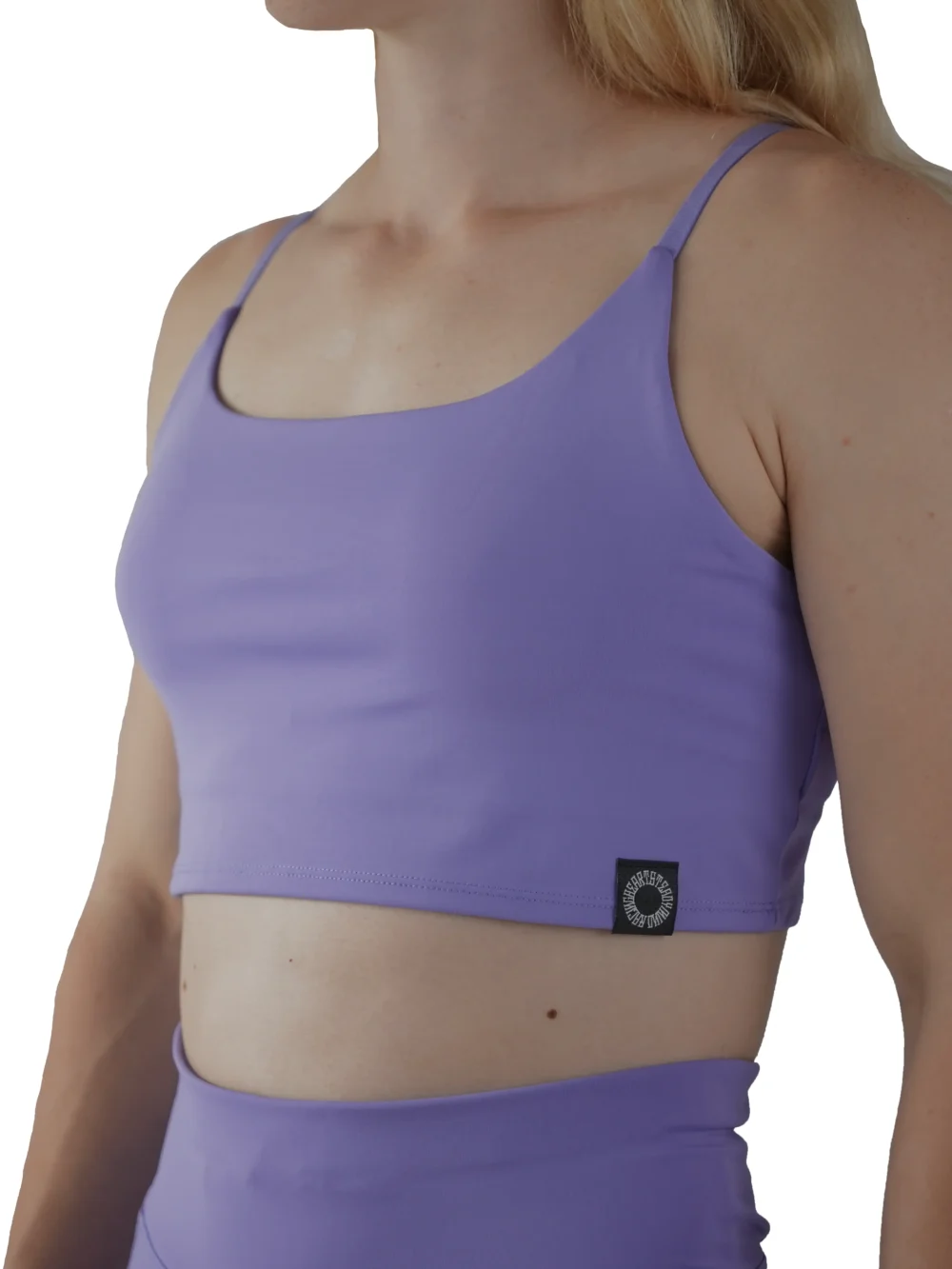 Model wearing the lavender RHSM Minimalist Sports Bra, demonstrating the secure, form-fitting support of the fitness apparel.