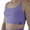 Model wearing the lavender RHSM Minimalist Sports Bra, demonstrating the secure, form-fitting support of the fitness apparel.