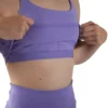 Detail shot showing the moisture-wicking interior and internal support structure of the lavender RHSM Minimalist Sports Bra.