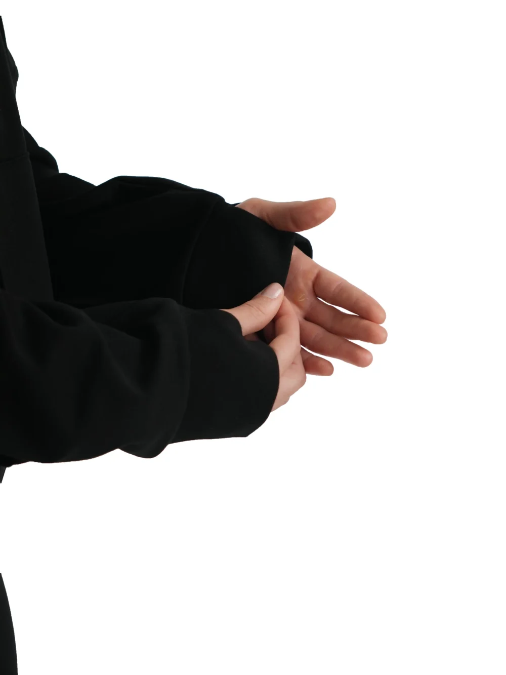 Close-up detail shot of the black hoodie's long sleeve and secure ribbed cuff