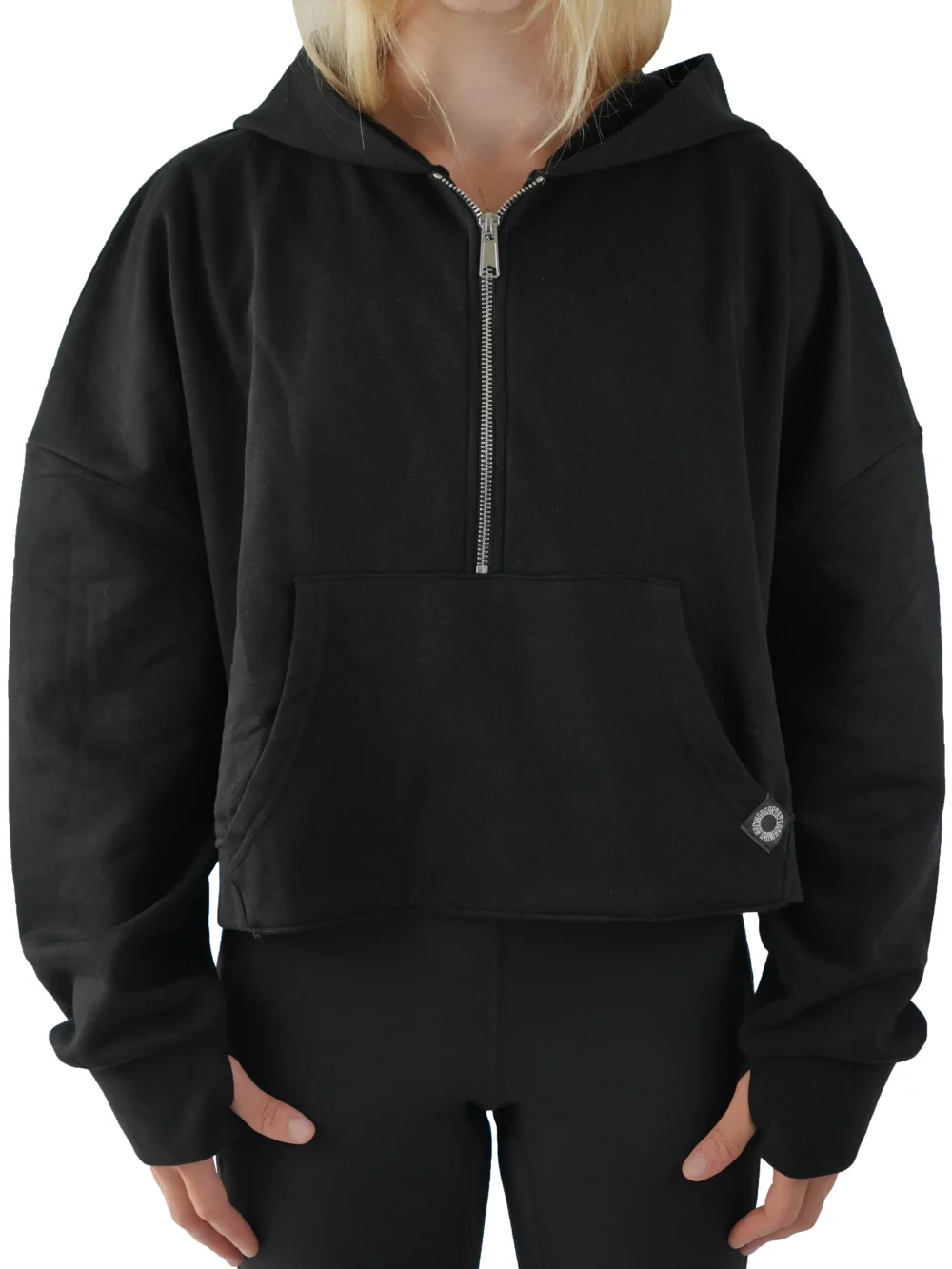 Model wearing the black RHSM Minimalist Half-Zip Hoodie, showing the oversized fit of the fitness apparel.