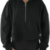 Model wearing the black RHSM Minimalist Half-Zip Hoodie, showing the oversized fit of the fitness apparel.