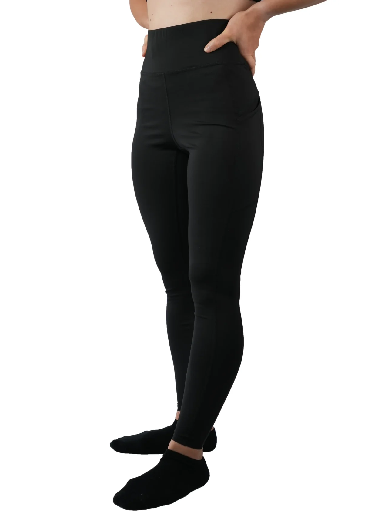 Model wearing the black RHSM Minimalist Leggings, showing the secure high-waist fit.