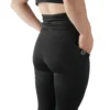 Model using the deep side pocket on the black leggings, essential workout gear from the RHSM calisthenics clothing brand.