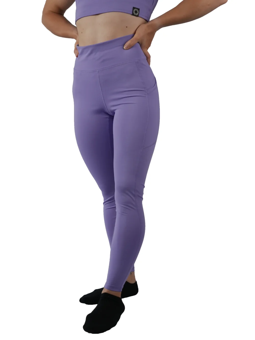 Model wearing the lavender RHSM Minimalist Leggings, demonstrating the secure drawstring waist.