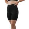 Model wearing the black RHSM Minimalist Shorts, showing the secure high-waist slim fit.