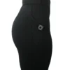 Model in a side profile wearing the black RHSM shorts, demonstrating the ergonomic fit and side pocket.