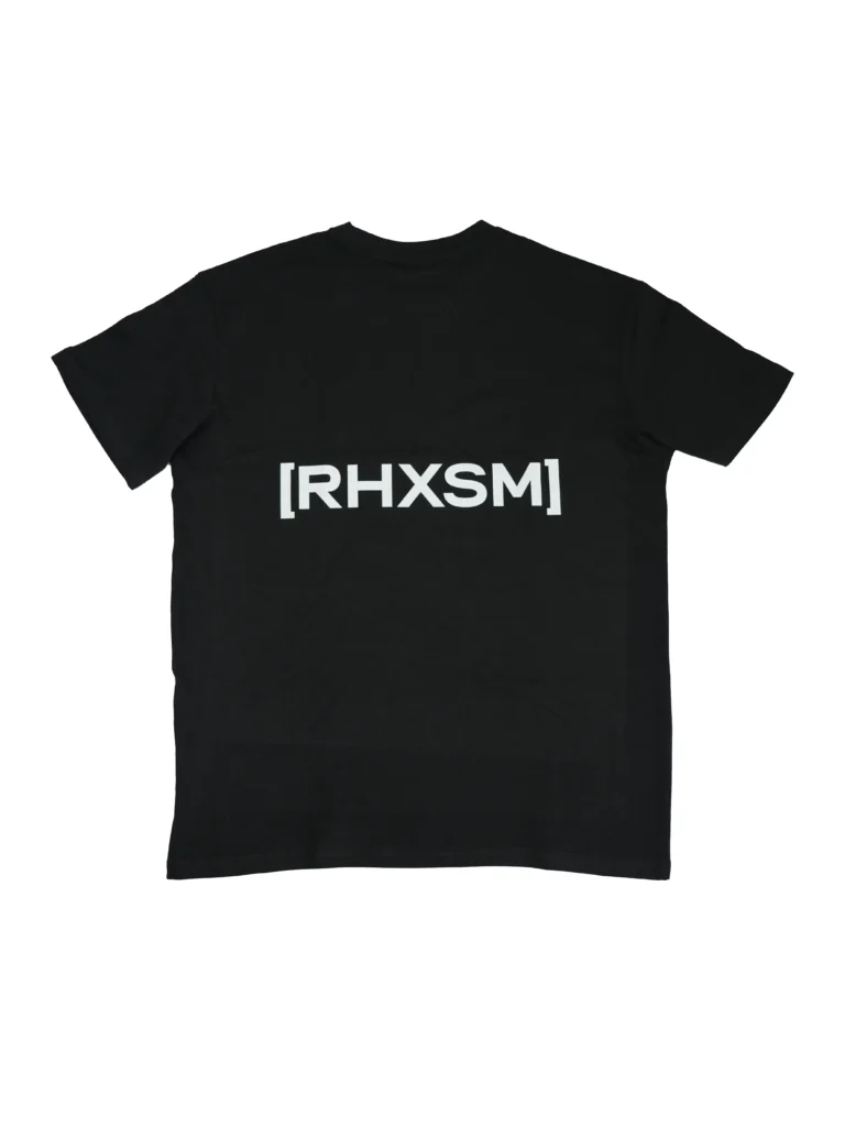 The black "[RHXSM]" oversized tee, laid flat (back view), showcasing the big, bold statement back graphic; premium calisthenics apparel from RHSM.