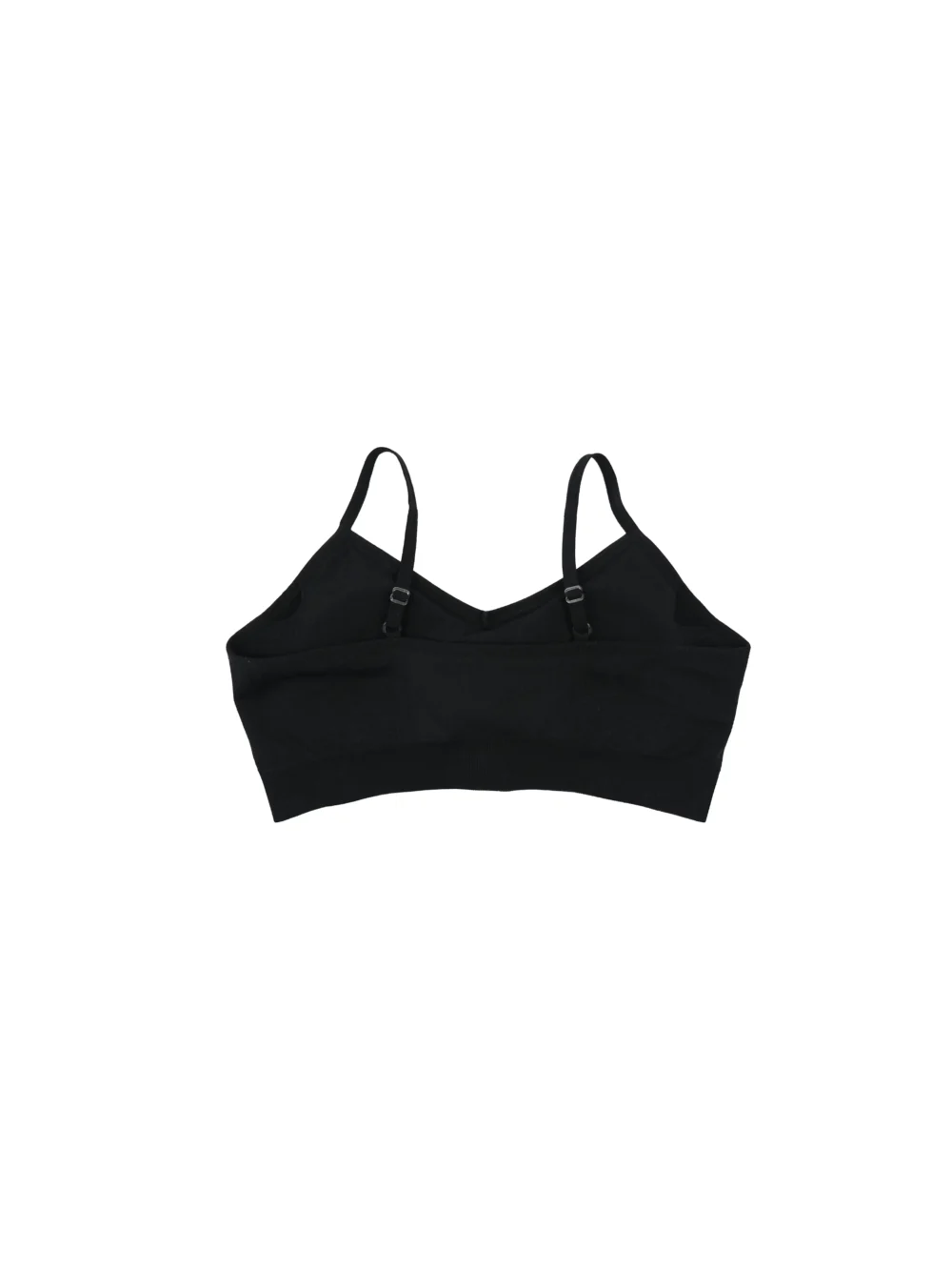 The black "[RHXSM]" sports bra, laid flat (back view), highlighting the seamless construction and ribbed detailing on the back; essential calisthenics apparel for women.