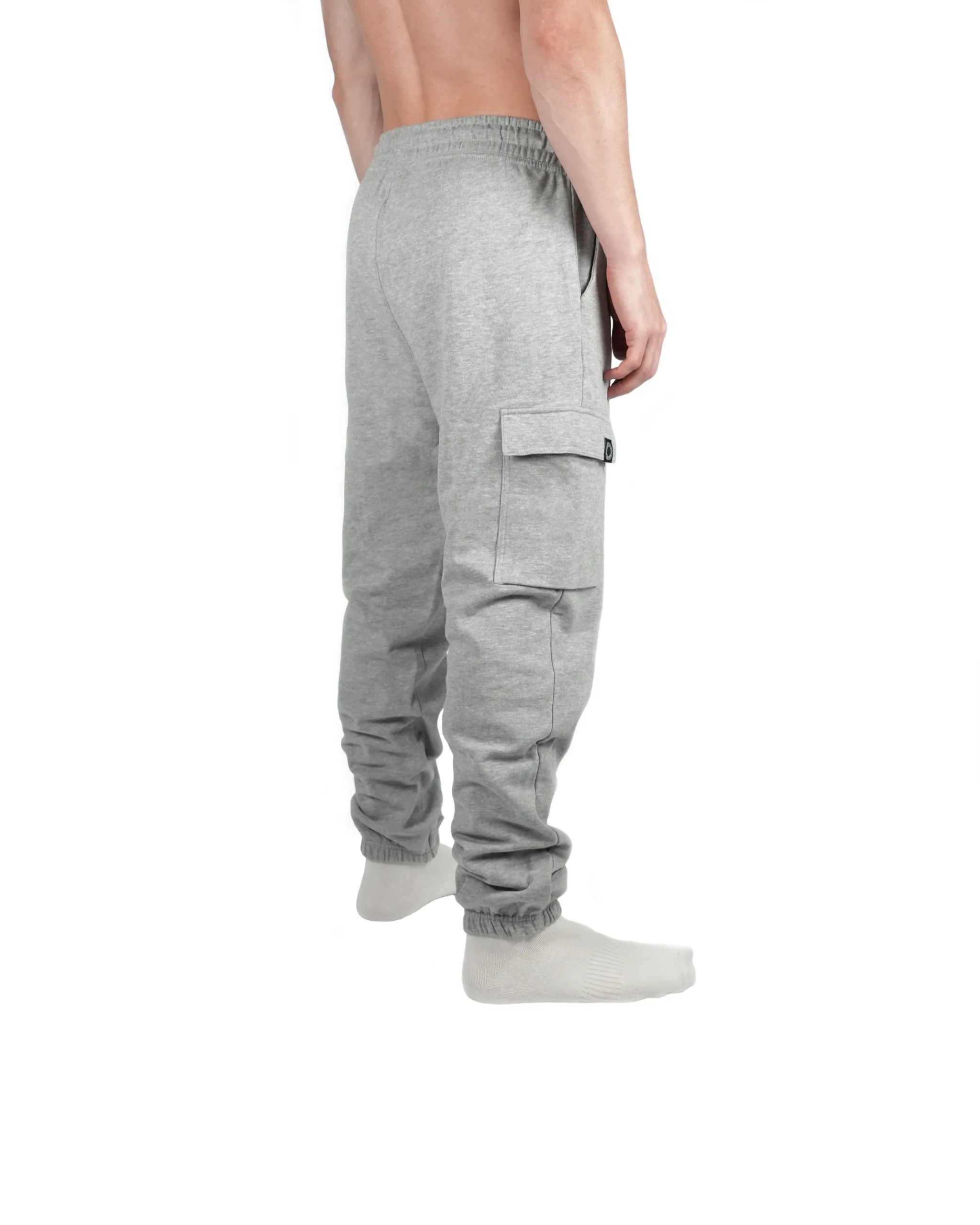 Model wearing gray RHSM cargo sweatpants from the back, showing how the lighter fabric moves with the body during exercise.