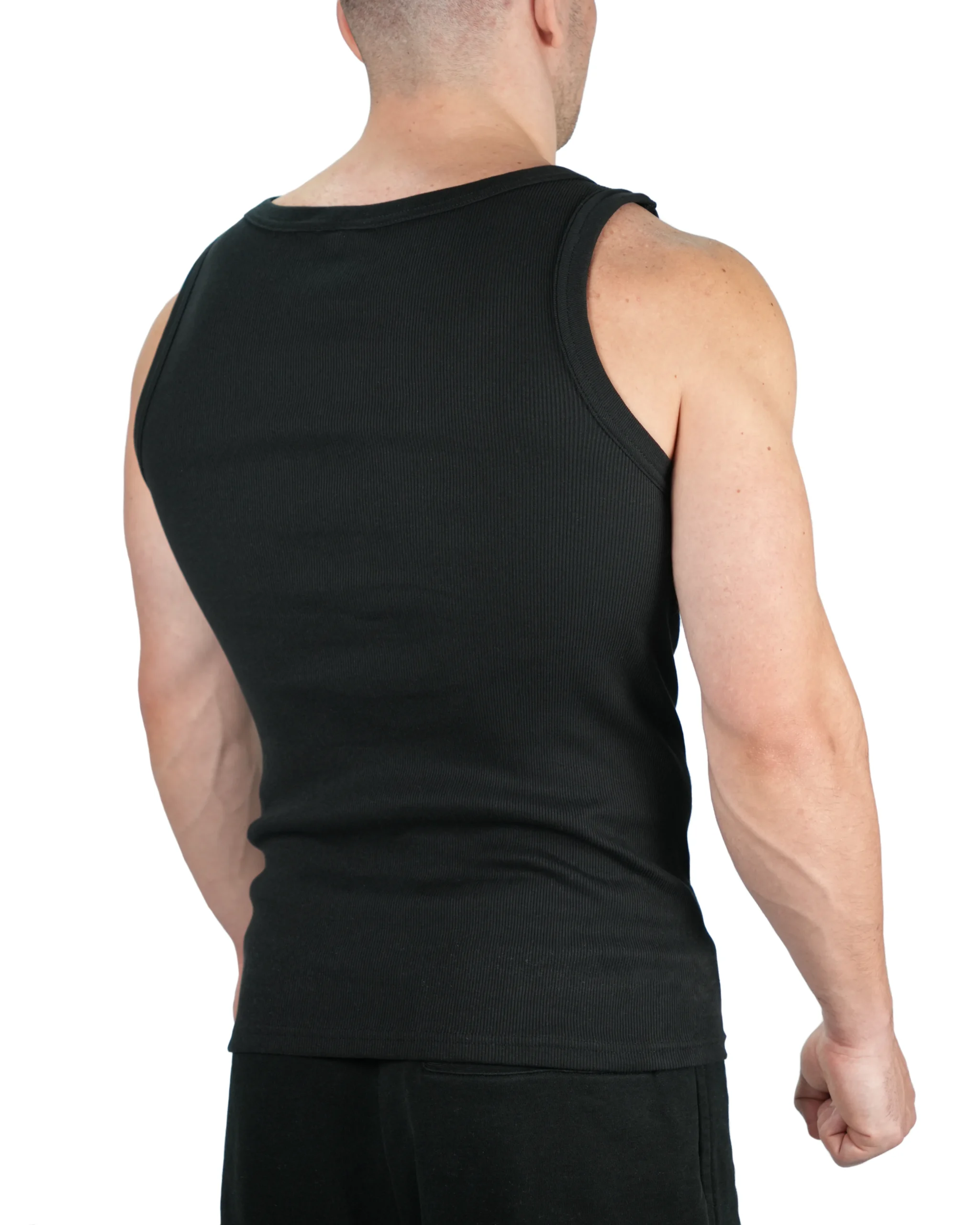 Model rear view in black RHSM ribbed tank, demonstrating the contour fit and substantial fabric weight.