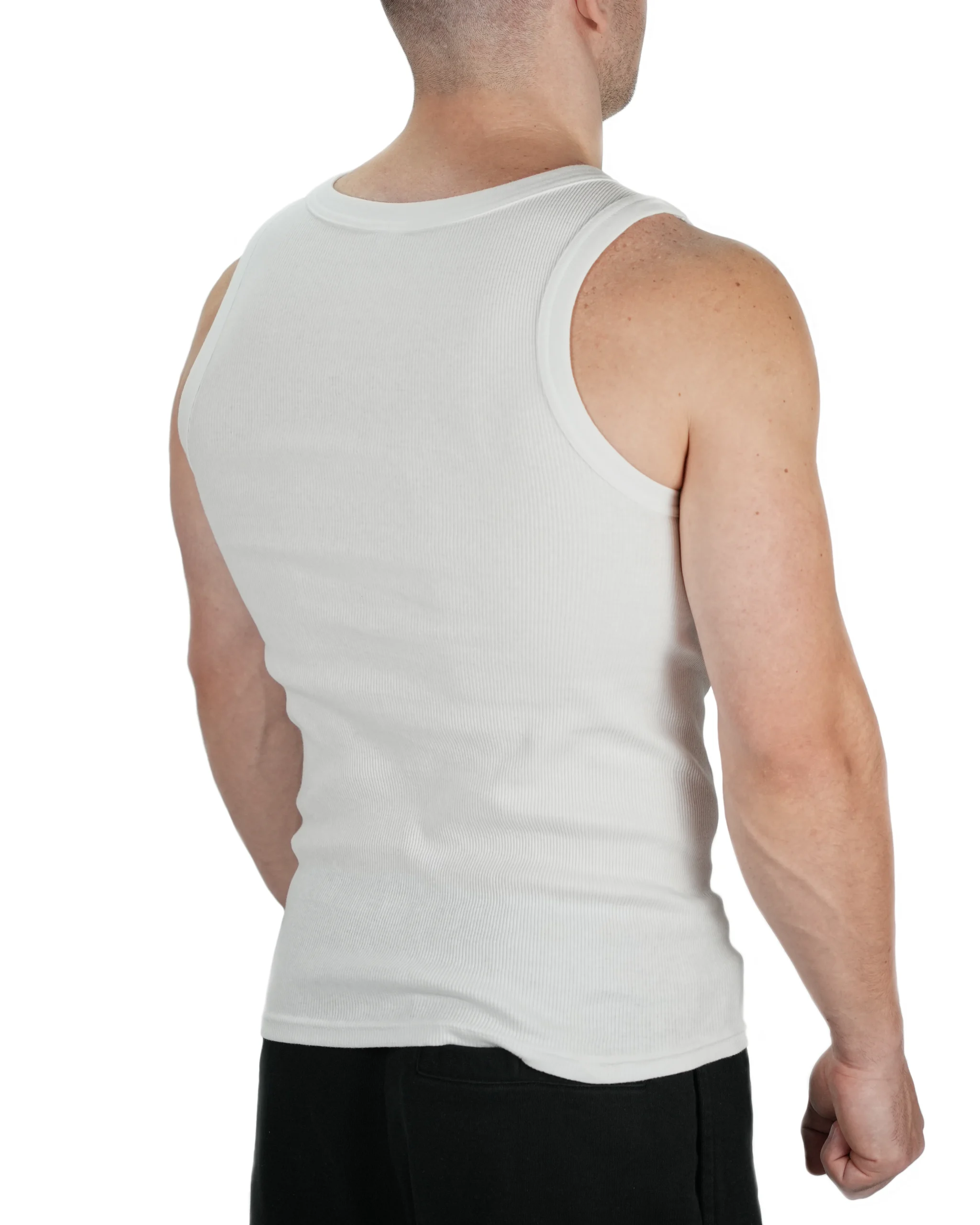 Rear view of model wearing white RHSM ribbed tank, highlighting shoulder exposure and heavy cotton drape for calisthenics movement.