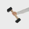Athlete holding the 5cm diameter beech handle of an RHSM Medium Parallette, essential high-performance fitness apparel equipment.